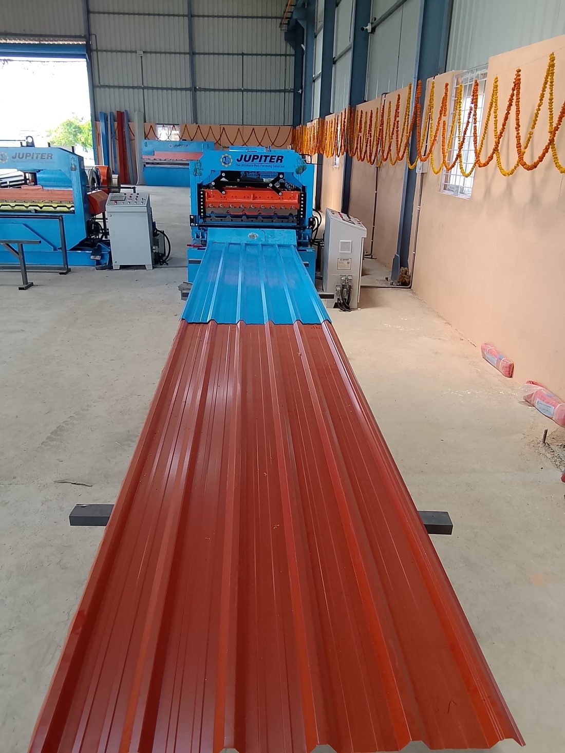Profiled roofing sheets running off our roll forming line